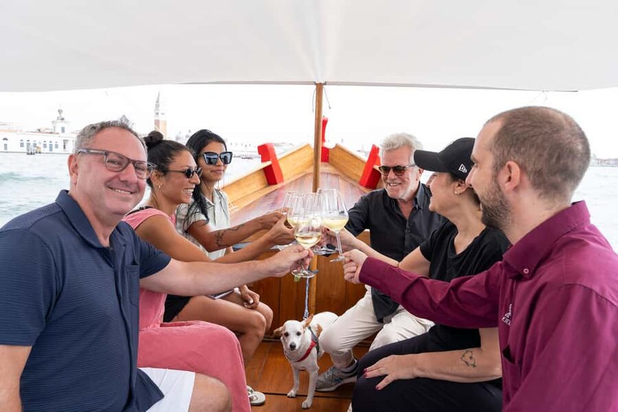 Check out Venice from a different angle: a scenic tour on a traditional boat. - The 1-hour flow: from Giudecca Canal skyline to San Marco photos