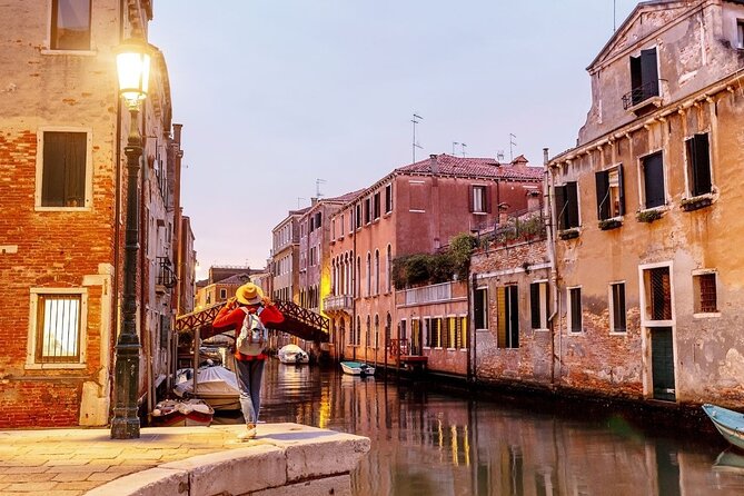 Private Venice Tour with a Local, Highlights & Hidden Gems, 100% Personalised - Stop 2: A quiet square with Moorish merchant statues and trade echoes
