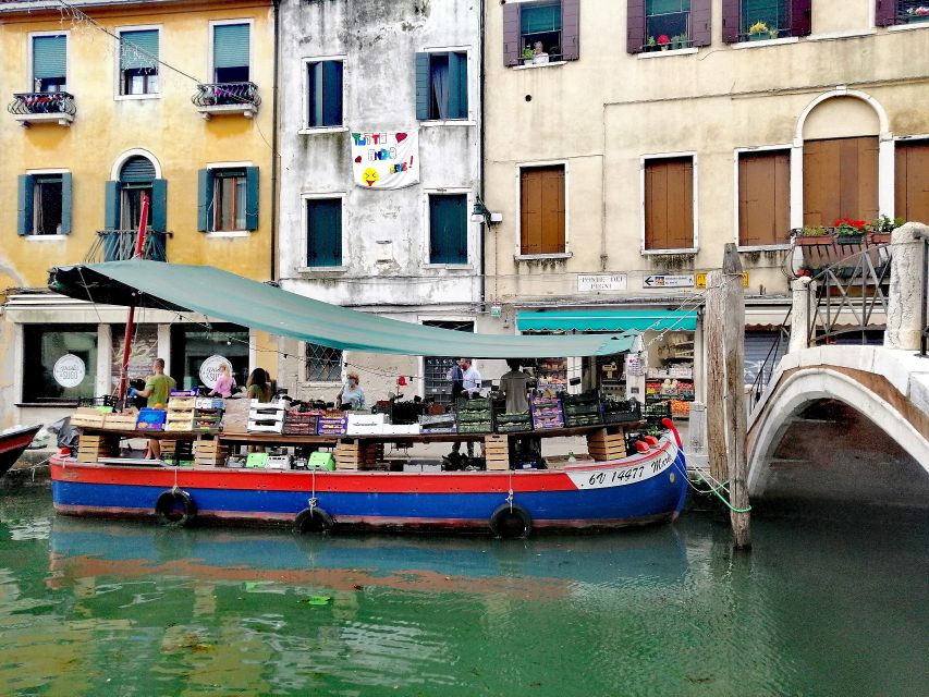 Venice: Off the Beaten Path Walking Tour - The canal stop: watching locals buy produce from a boat